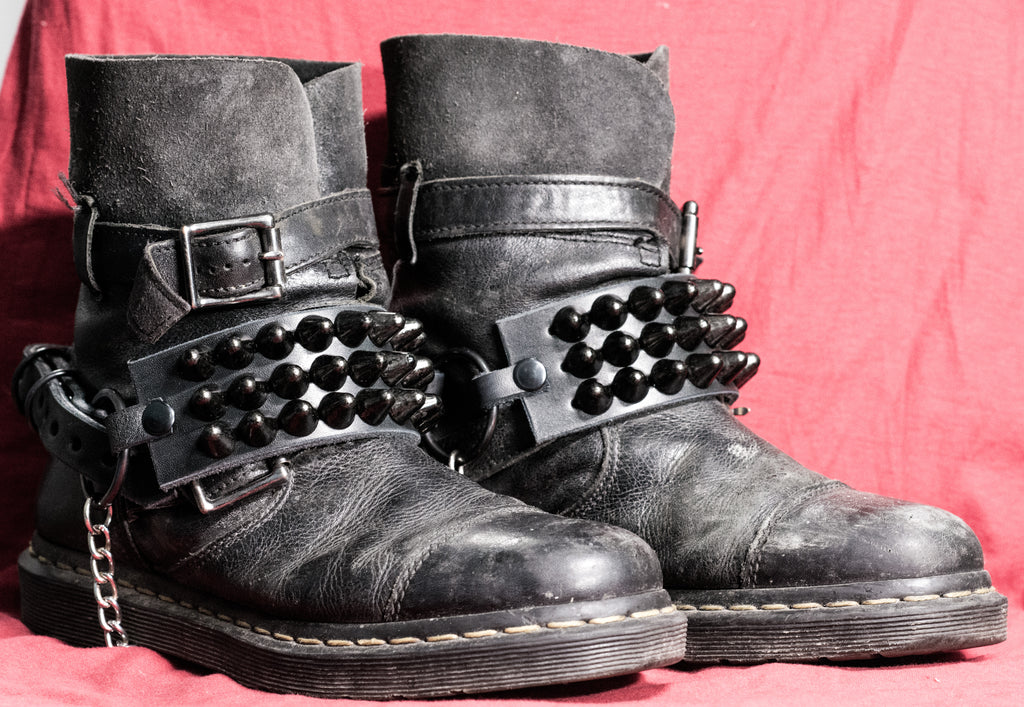 Black three-row stud straps