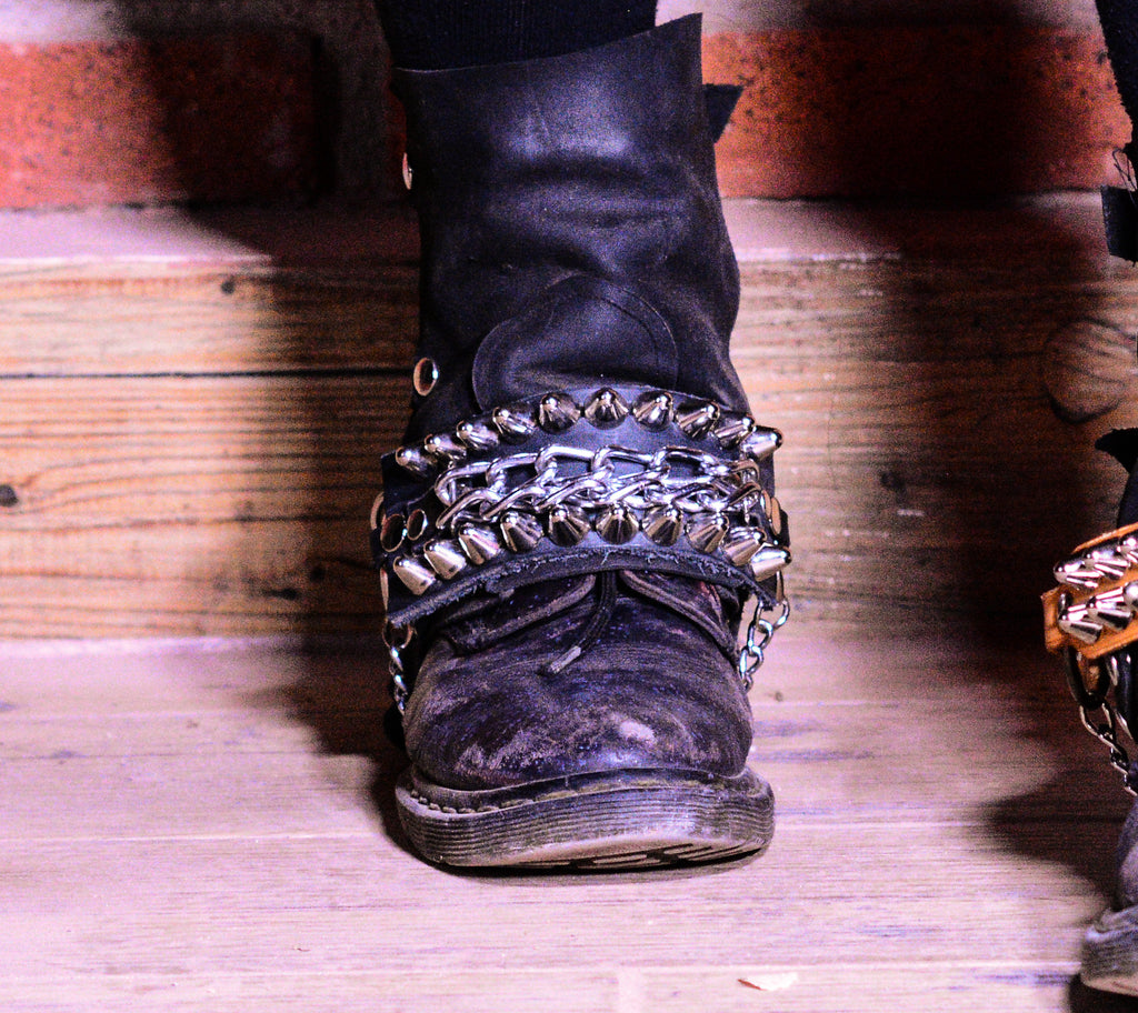 Straps with studs and chain.