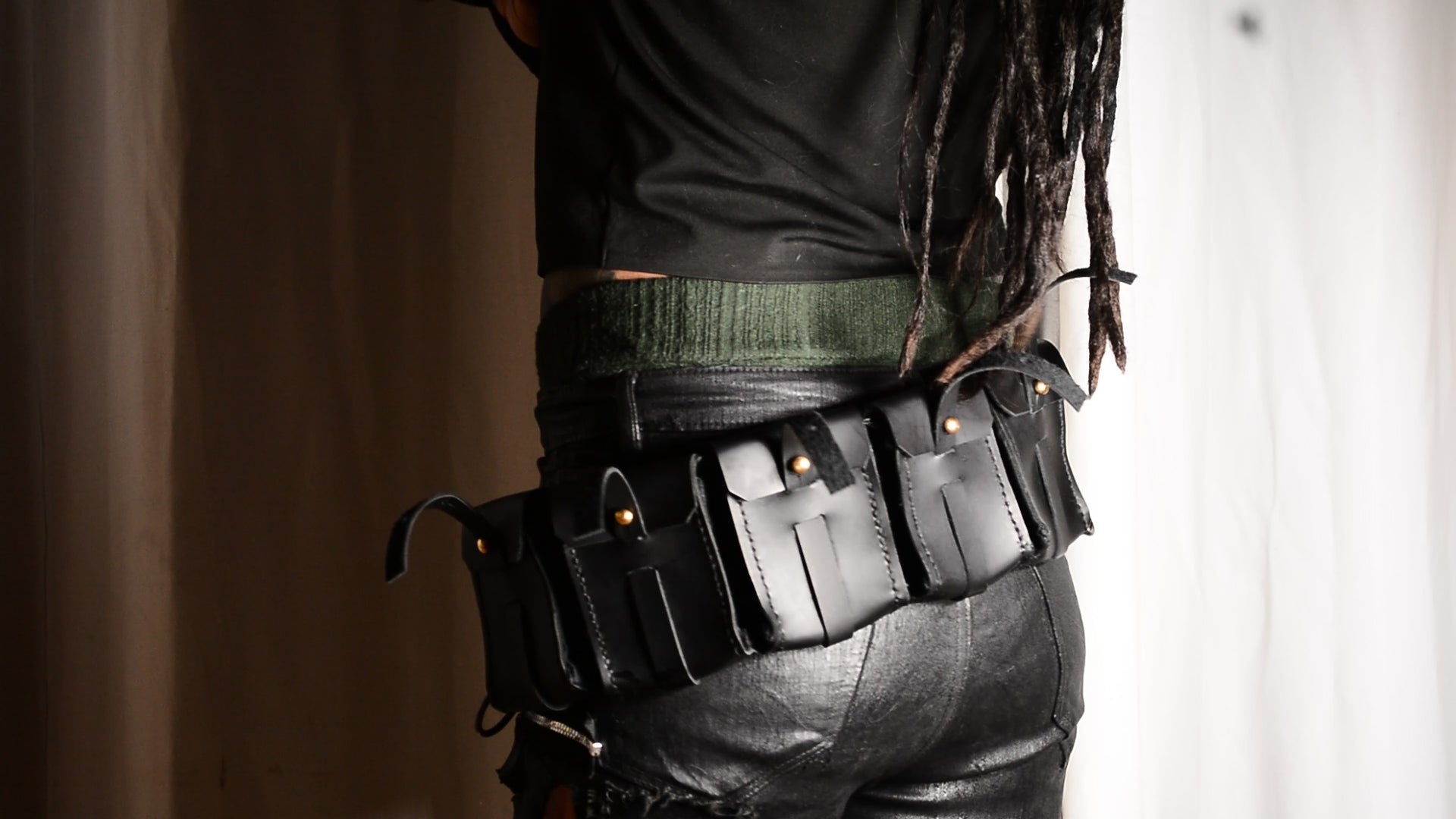 Three-row black stud belt